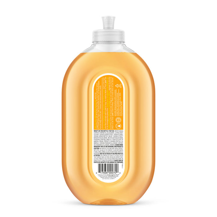 A translucent bottle of Leaping Bunny–certified orange dish soap is showcased from the back, featuring a clear flip-top cap and a rectangular label with small text, reminiscent of the packaging for method Squirt & Mop Hard Floor Cleaner.