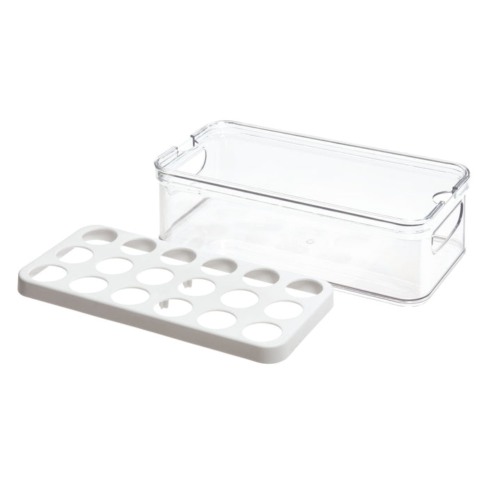 IDesigns Stackable Fridge Egg Bin, crafted from durable BPA-free plastic, is a clear rectangular container with a white tray featuring holes for ventilation, perfectly fitting inside. It has short side handles and functions as a fridge egg bin with its stackable design. Made from recycled materials.