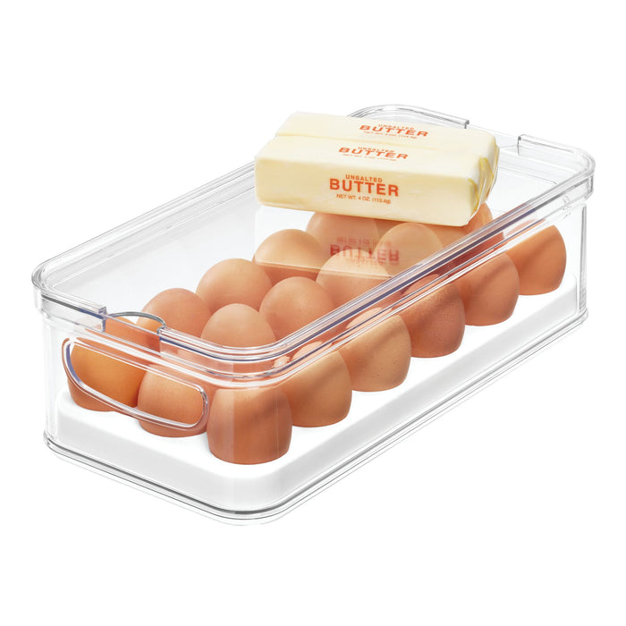 The iDesign Stackable Fridge Egg Bin, crafted from durable BPA-free recycled plastic, holds a dozen brown eggs and a pack of unsalted butter. Its design allows the butter to rest gently on top while the eggs are neatly arranged inside for easy storage.