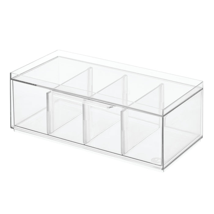 The iDesign Stackable Tea Organizer, crafted from BPA-free recycled plastic, elegantly features three divided sections with a lid for tea packet storage. Its stackable design offers convenient space-saving on a white background.