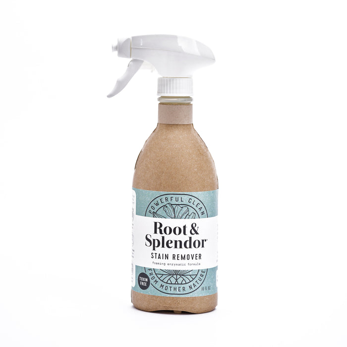 Root & Splendors Stain Remover comes in a spray bottle with paper covering and white label reading Powerful Clean and Foaming Enzyme Action. It features a white spray nozzle and eco-friendly packaging made with natural ingredients.