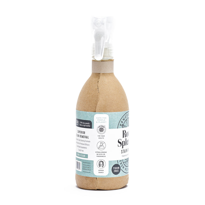 The Root & Splendor Stain Remover is packaged in brown paper, highlighting its eco-friendly nature. Icons show its made with natural ingredients, safe for pets and kids, biodegradable, and toxin-free. It includes a clear spray nozzle.