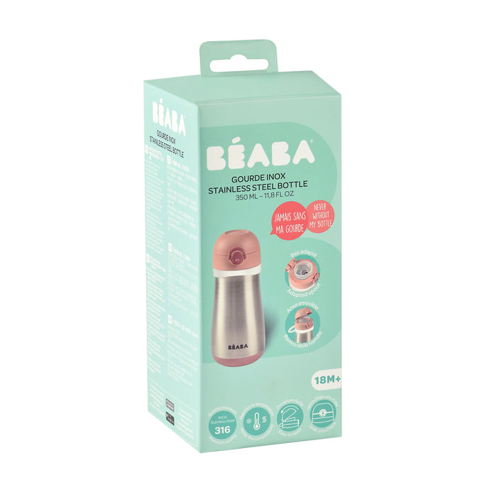The packaging for the BEABA Stainless Steel Toddler Thermos Water Bottle, suitable for ages 18+ months, features a green and pink design showcasing a 350ml BPA-free bottle with a leakproof push-button lid. It emphasizes durability and child-friendly design.