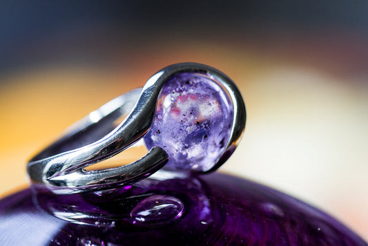 Sterling silver ring featuring a 12mm purple marbled glass marble infused with cremation ash.