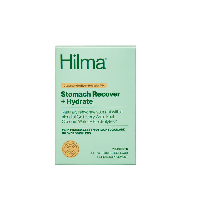 A box of Hilma Stomach Recover + Hydrate supplement with a coconut and goji berry hydration mix. The packaging highlights natural ingredients, including gastroprotective herbs, amla fruit, coconut water, and electrolytes. Includes 7 sachets.