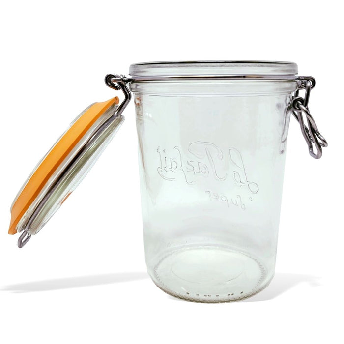 The Le Parfait 1L Storage and Canning Glass Jar features clear glass, a hinged metal clasp, an orange rubber seal, and embossed text on the side, making it ideal for plastic-free food storage. It stands upright against a plain white background.