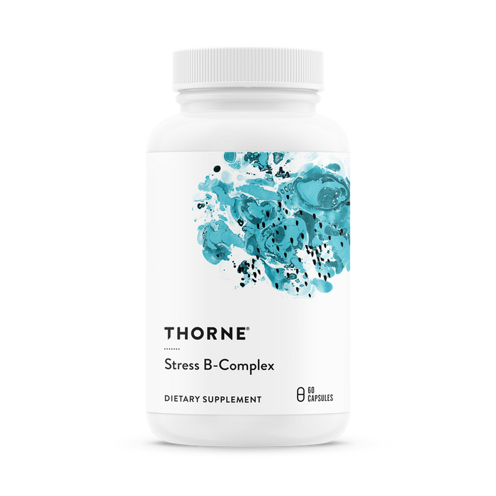 A white bottle labeled Thorne Stress B-Complex features abstract blue splashes and holds 60 capsules. Packed with essential B vitamins, it supports adrenal health and boosts immune function for overall well-being.
