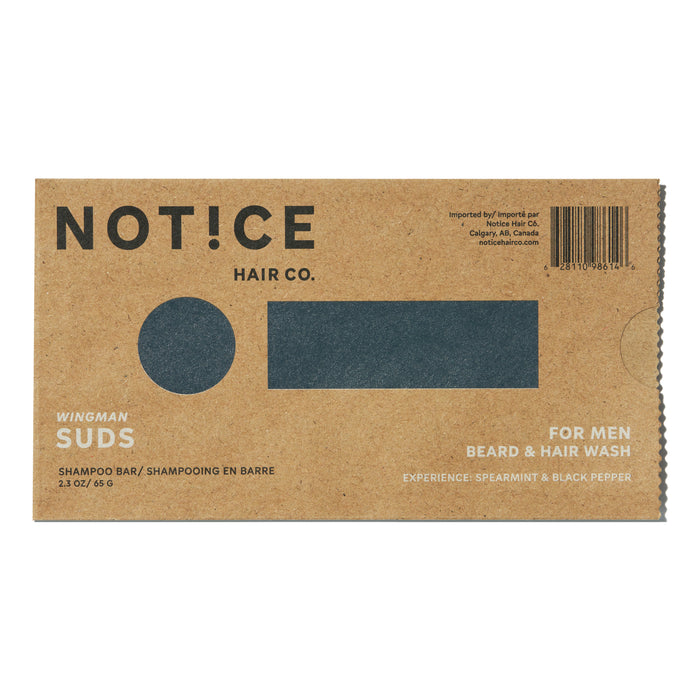 The Suds Shampoo Bar by NOT!CE Hair Co. comes in a light brown box with bold black lettering and a darkened rectangle, highlighting its beard and hair wash benefits for men. Infused with spearmint and black pepper scent, this plastic-free option promotes healthy hair growth sustainably.