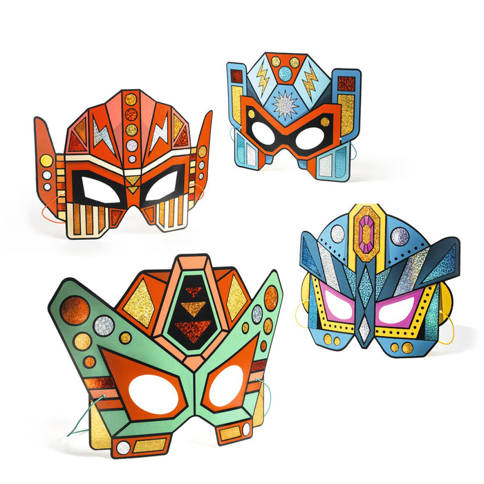 Four colorful Super Robots masks with geometric designs and vibrant colors are displayed against a white background. Each mask, from the DJECO Super Robots DIY Craft Kit made with FSC® Certified Paper, features circles, triangles, and lightning bolts for endless creative fun.