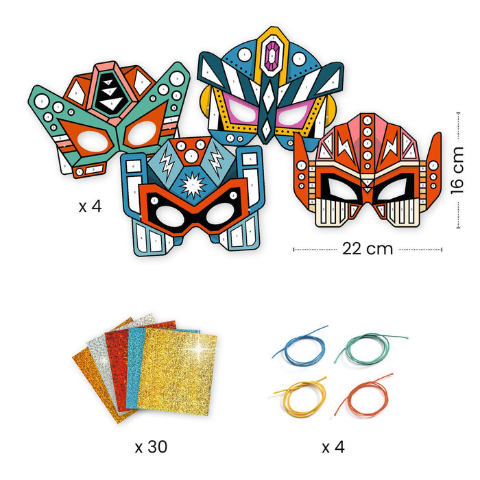Four colorful superhero masks with geometric designs and eye cutouts are arranged above. Below are four colored strings and five sheets of glitter paper. Dimensions are indicated as 16 cm in height and 22 cm in width for the masks.