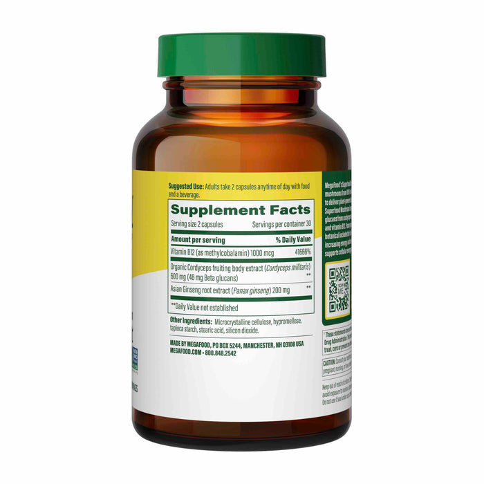A brown bottle with a green lid, labeled Superfood Mushroom - Energy Support by MegaFood, contains dietary supplements with Vitamin B12, Cordyceps mushrooms, and Asian ginseng root extract. The label details supplement facts, serving size, ingredients, and manufacturer contact information.