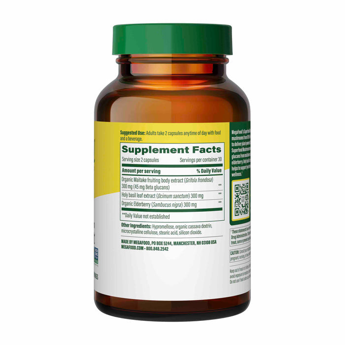 A brown bottle labeled Superfood Mushroom - Immune Support by MegaFood shows suggested use and supplement facts. It contains organic maitake, turkey tail extract, and elderberry. Contact info for Forest Road, Manchester and a QR code are included.
