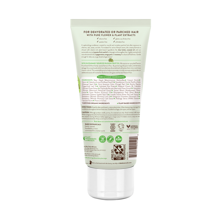 The Swim & Sport Conditioner from Babo Botanicals is ideal for dehydrated hair, made with sustainably sourced passion fruit oil. The white tube has green and black text detailing ingredients, sustainability certifications, and usage instructions.