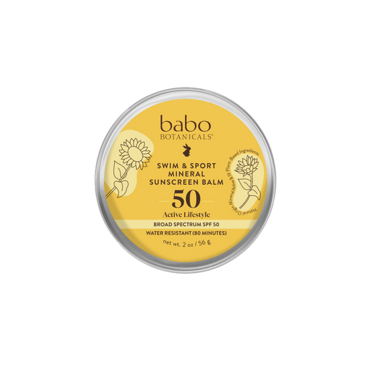 Babo Botanicals Swim & Sport Mineral Balm - SPF 50 comes in a travel-friendly, round yellow tin with a sunflower-adorned lid. This plastic-free sunscreen provides broad-spectrum protection and is water-resistant for up to 80 minutes.