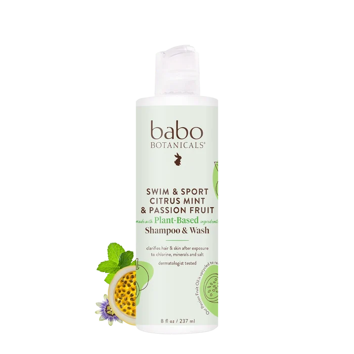 A bottle of Babo Botanicals Swim & Sport Shampoo and Wash, displayed against a white background with images of passion fruit and mint. This clarifying formula, enriched with passion fruit oil, is available in an 8 fl oz (237 ml) bottle.