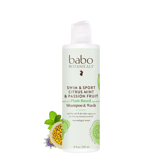 A bottle of Babo Botanicals Swim & Sport Shampoo and Wash, displayed against a white background with images of passion fruit and mint. This clarifying formula, enriched with passion fruit oil, is available in an 8 fl oz (237 ml) bottle.