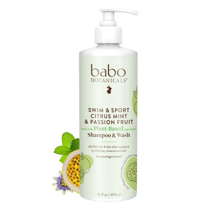 A white pump bottle of Babo Botanicals Swim & Sport Shampoo and Wash, adorned with fruit and mint illustrations, features passion fruit oil for a refreshing cleanse. This 16 fl oz clarifying shampoo is ideal for active lifestyles.