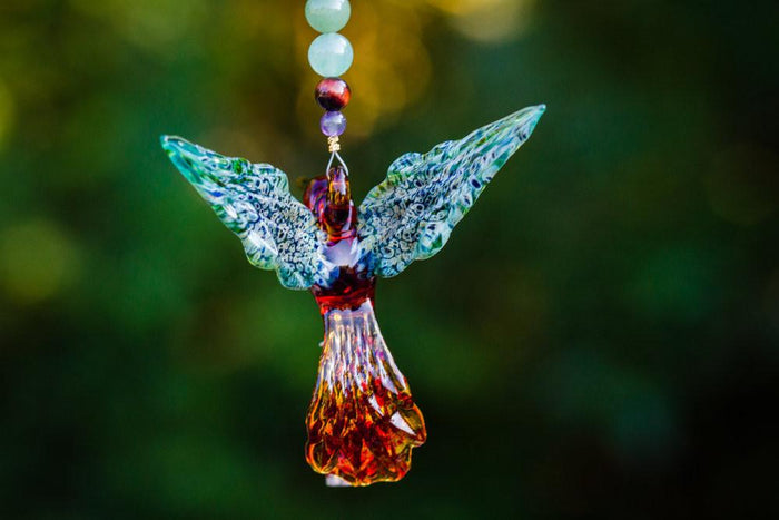 Tan and green hummingbird pendant with beaded strand and detachable sterling silver keepsake urn for ashes.