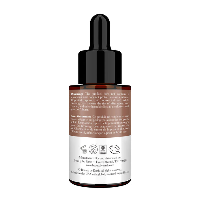 A brown glass dropper bottle with a black cap, labeled with warnings and Beauty by Earths info, likely for cosmetics or skincare. The website suggests it contains Tanning Drops for a natural-looking tan using organic ingredients.