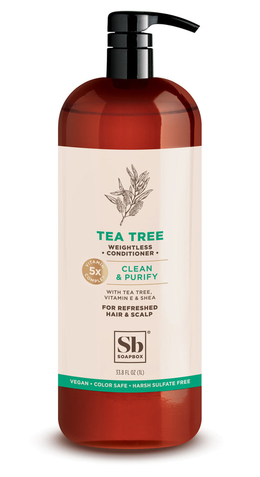 The Soapbox Conditioner Tea Tree 1 Liter Luxe is packaged in a tall brown bottle with a pump, featuring tea tree oil, vitamin E, and shea for refreshed hair and scalp. This purifying wash is vegan, color-safe, sulfate-free and contains 33.8 fl oz (1L).