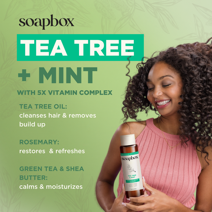 A smiling curly-haired woman holds a bottle of Soapbox Tea Tree & Mint Scalp Balancing Conditioner, noting benefits like 5X vitamin complex for light hydration, Tea Tree Oil for cleansing, and Rosemary for restoring. Leaf patterns decorate the background.