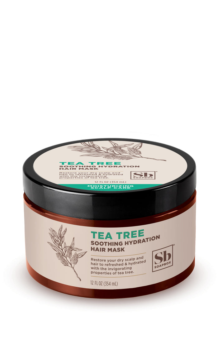 Soapboxs Tea Tree Soothing Hydration Hair Mask in a brown jar with a black lid features botanical tea tree art. The 12 oz (354 ml) mask, infused with tea tree oil, provides moisturizing benefits for dry scalps.