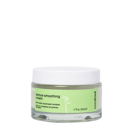 A 1.7 fl oz (50 ml) jar of Cocokind Texture Smoothing Cream enriched with Tsubaki seed oil, featuring a green label and white lid adorned with text and a plant stem illustration, perfect for daily moisturizing.