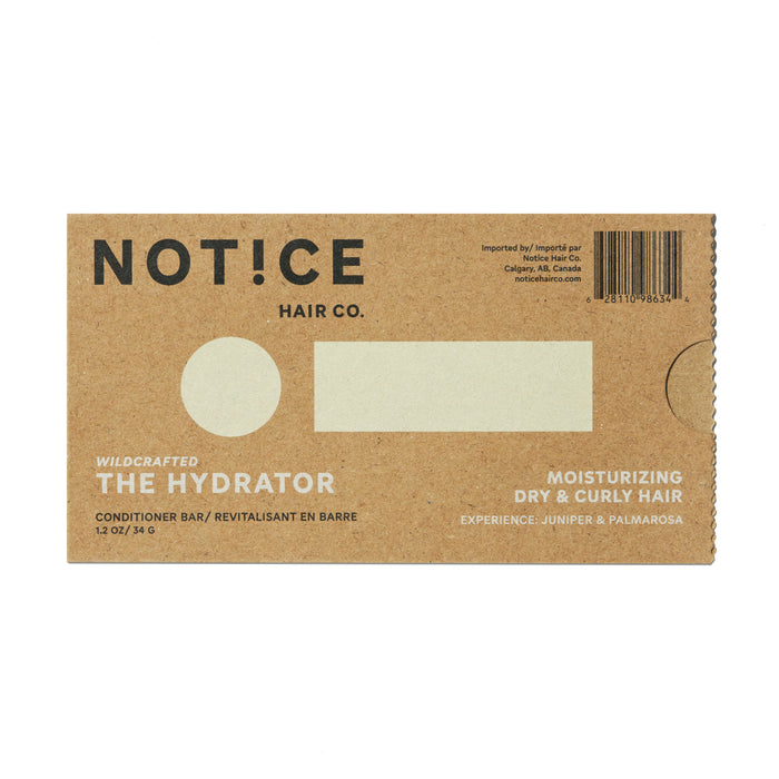 The Hydrator Conditioner Bar from NOT!CE Hair Co comes in brown cardboard packaging. It offers wildcrafted, plastic-free care for dry and curly hair, with juniper and palmarosa essential oils. A barcode is located at the top right corner.
