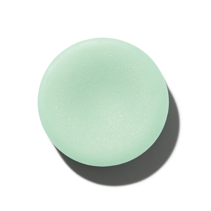 The Stimulator Conditioner Bar from NOT!CE Hair Co, a soft-textured, mint-green circle, casts a shadow on the white background.