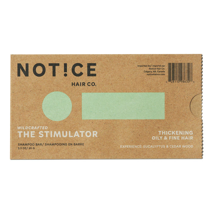 NOT!CE Hair Cos The Stimulator Shampoo Bar in eco-friendly cardboard promotes thickening for oily and fine hair. Infused with eucalyptus and cedar wood, it features a green square packaging, offering a plastic-free solution for healthy hair growth.
