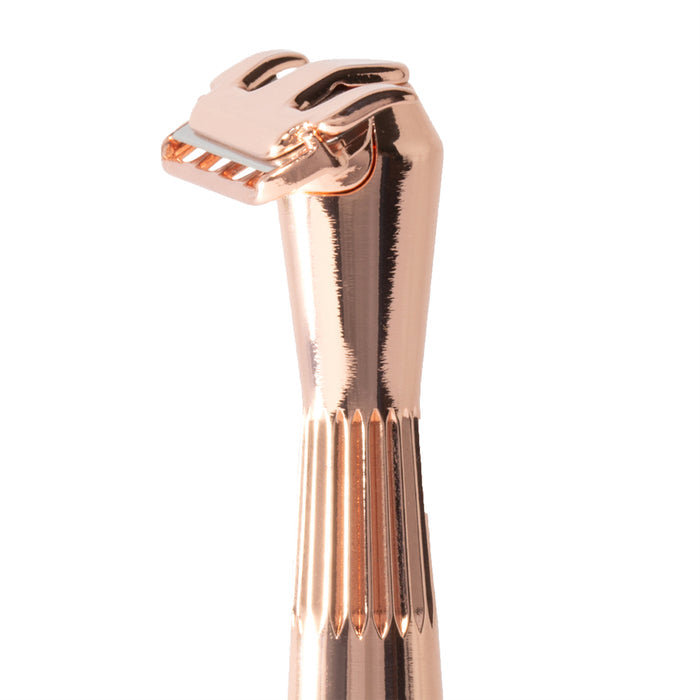 Close-up of The Twig Plastic-Free Razor by Leaf Shave in rose gold, showcasing a sleek, modern design with an ergonomic handle for precise grooming. The textured finish of the single-edge blade contrasts against a plain white background.