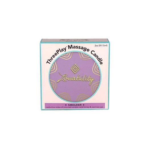 The image showcases Lovabilitys ThreePlay Massage Candle with a purple and teal design. This 2 oz (59.15 ml) candle in the Smolder scent combines juicy red currants, wild honey, and warmed oak, and doubles as an ultra-hydrating moisturizer.