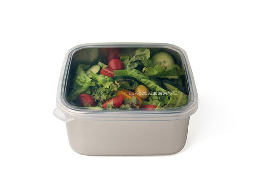 The U-Konserve To-Go Large Container is an eco-friendly stainless steel container with a clear, silicone-topped lid, ideal for carrying fresh salads like lettuce, cherry tomatoes, cucumber slices, and green peppers. Perfect for sustainable meals on the go.