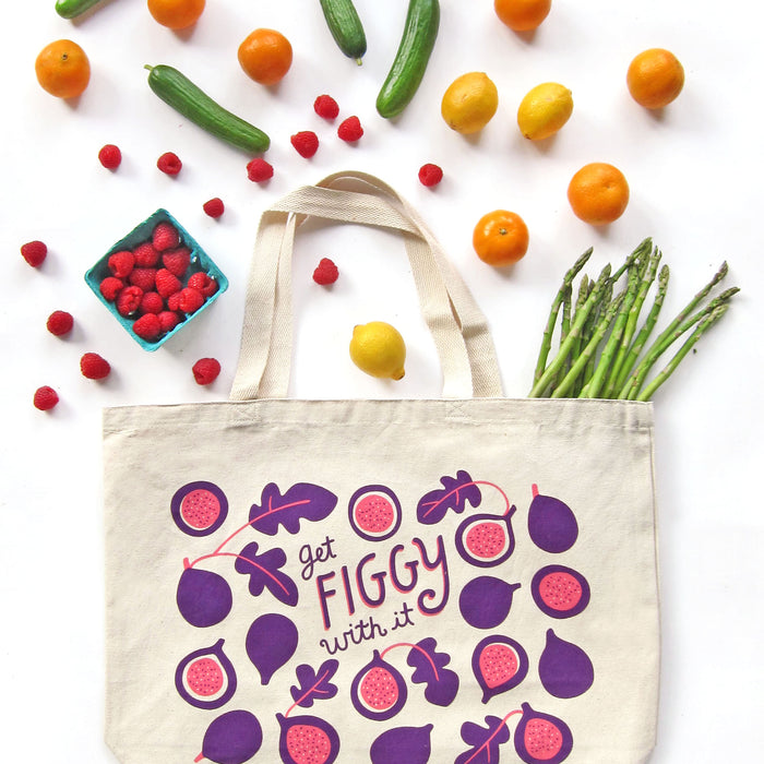 The Neighborgoods Tote Bag is an eco-friendly gift featuring Get Figgy with it on a white background, adorned with vibrant figs, raspberries, lemons, clementines, cucumbers, and asparagus. Perfect for farmers market trips.