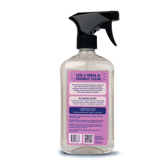 Aunt Fannies Toy + Highchair Cleaner comes in a clear spray bottle with a black trigger. The purple label reads For a Fresh & Friendly Clean and includes cleaning tips, ingredients, instructions, QR code, and manufacturer details. Its the perfect fragrance-free cleaner for toys and highchairs.