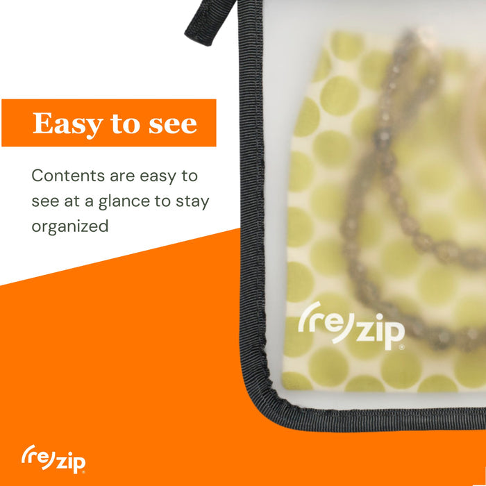 A close-up of the (re)zip Travel Organizer Zipper Bag - Medium showing jewelry inside. Text reads: Easy to see. Keep small essentials visible and organized on the go with this clear storage pouch.