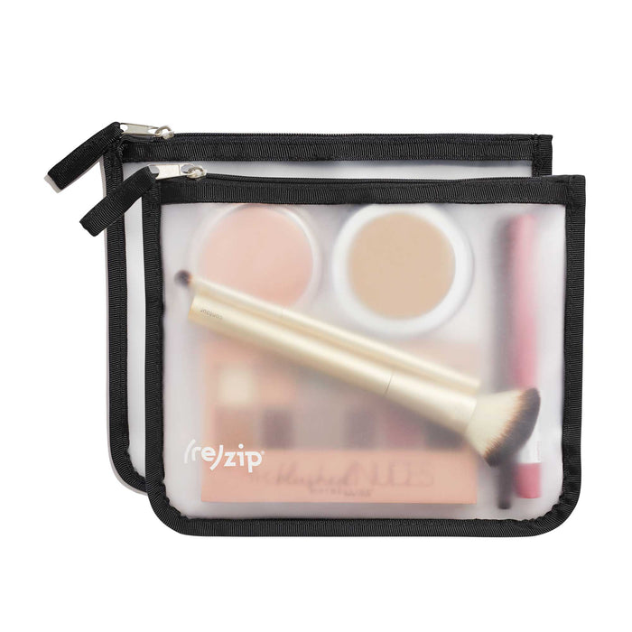 The (re)zip Travel Organizer Zipper Bags - Medium are two translucent pouches with black edges, ideal for organizing essentials or travel gear. Each zippered bag fits makeup items and features the (re)zip logo on the front.