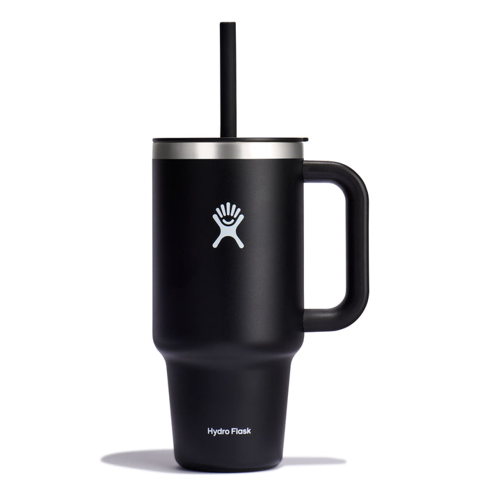 32 oz black insulated travel tumbler by Hydro Flask, featuring a handle, straw, white logo, and leak-resistant lid.