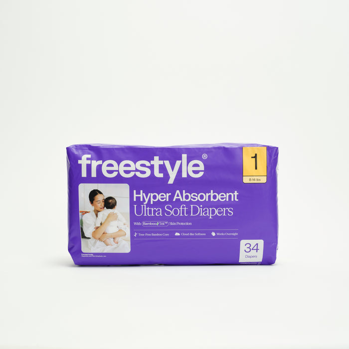 A purple pack of Freestyle Tree Free Bamboo Diapers, size 1 for 8-14 lbs, features a mom holding a baby on the front. Each eco-friendly pack contains 34 ultra-soft, hyper absorbent diapers.