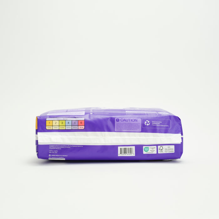A side-view of Freestyle's Tree Free Bamboo Diaper shows its purple rectangular package with a barcode, caution label, recycling symbol, and colored sizing chart—emphasizing your eco-friendly choice for sustainable diapering.