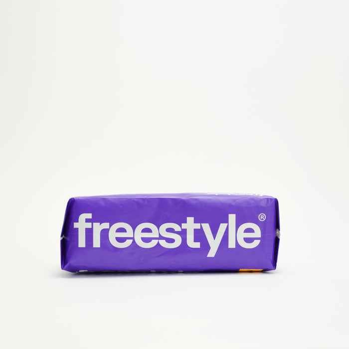 A rectangular package wrapped in purple paper displays "Freestyle" in large white letters on the front, featuring Tree Free Bamboo Diapers by Freestyle, set against a plain white background.