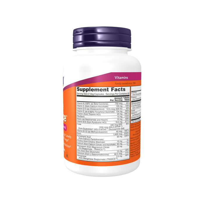 The True Balance - Multi Vitamin & Mineral by NOW Foods comes in a white bottle with a blue cap. It features Supplement Facts on the label, listing Vitamins A, C, D3, E, and B vitamins including biotin for healthy carbohydrate metabolism. The bottle is set against a plain white background.