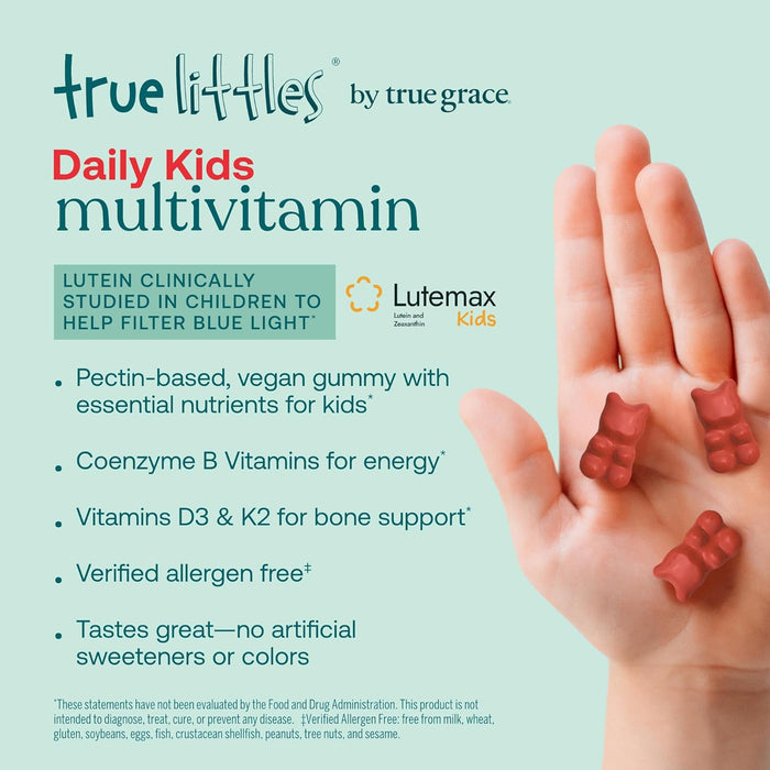 A hand holds two red gummies beside text for True Littles Daily Kids Multivitamin Gummies by True Grace, featuring lutein, B vitamins, vegan D3 & K2. Allergen-free and free from artificial sweeteners or colors.