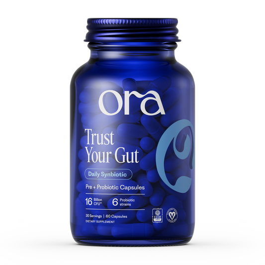 A blue bottle of Ora Organic Trust Your Gut: Daily Pre + Probiotic Capsule holds 60 vegan, non-GMO capsules with 16 billion CFU, 6 probiotic strains, and prebiotics for gut health.