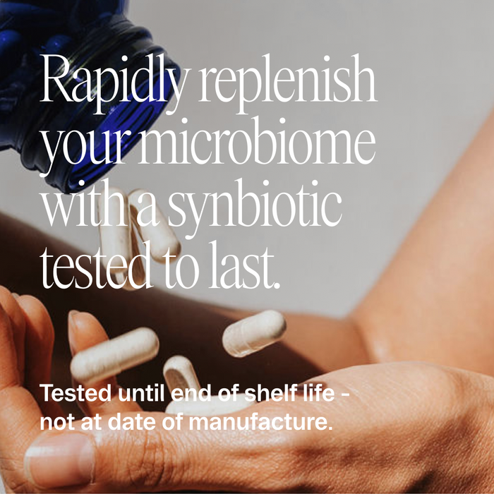 A hand pours white capsules from a blue Ora Organic bottle onto a palm, highlighting Trust Your Gut: High Potency Pre + Probiotic Capsules for microbiome health and recovery.