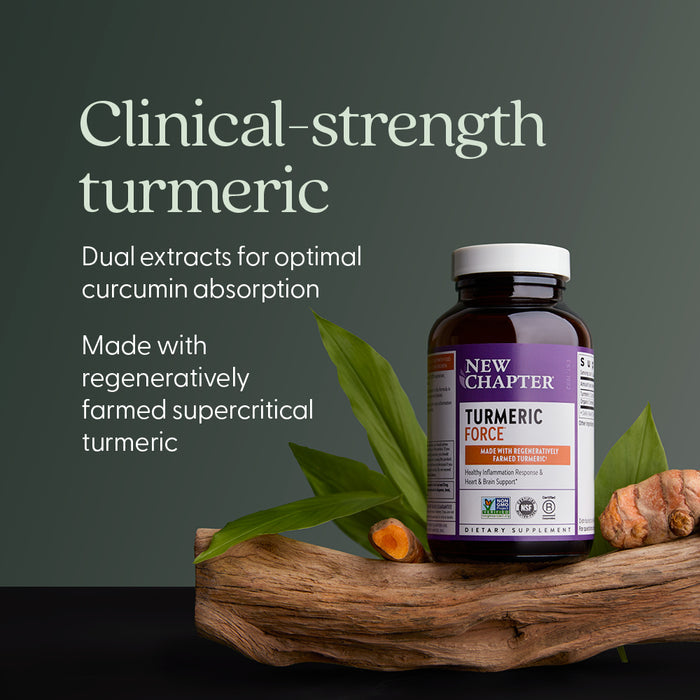 New Chapter Turmeric Force™, Healthy Inflammation Response, is displayed on wood with turmeric roots and green leaves, featuring text about clinical-strength turmeric, curcumin content, and regenerative farming.