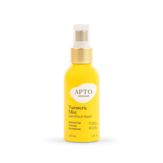 APTO Skincares Turmeric Mist with Witch Hazel, Reviving & Brightening Facial Spritz in yellow has a golden nozzle, white cap, holds 120 mL (4 fl. oz), and promises glowing skin with a refreshing, cooling, cruelty-free experience.