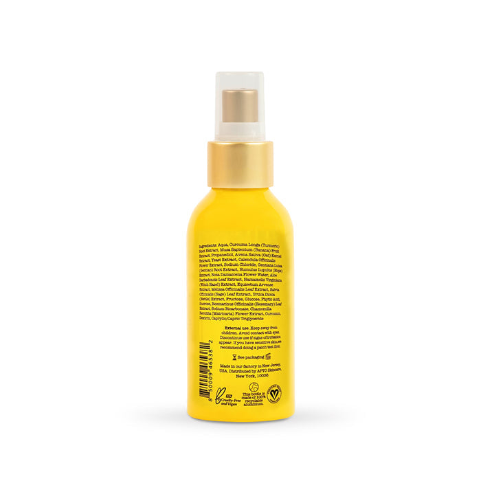 The APTO Skincare Turmeric Mist with Witch Hazel is a reviving, brightening facial spritz in a yellow spray bottle with a pump top. It features a beige cap and spray nozzle, detailed ingredients on the label, and is cruelty-free, all set against a crisp white background for glowing skin.