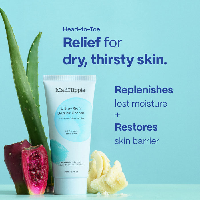 A tube of Mad Hippie Ultra-Rich Barrier Cream is placed beside a sliced dragon fruit, aloe leaf, and cream portion on a blue background. Text advertises relief for dry skin, highlighting moisture replenishment and skin barrier restoration.