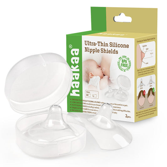 Haakaas Ultra-Thin Silicone Nipple Shields (Size M, 18mm) packaging features a baby photo, product details, and two transparent BPA-free shields for sore nipples. The box provides usage instructions and benefits for breastfeeding support.